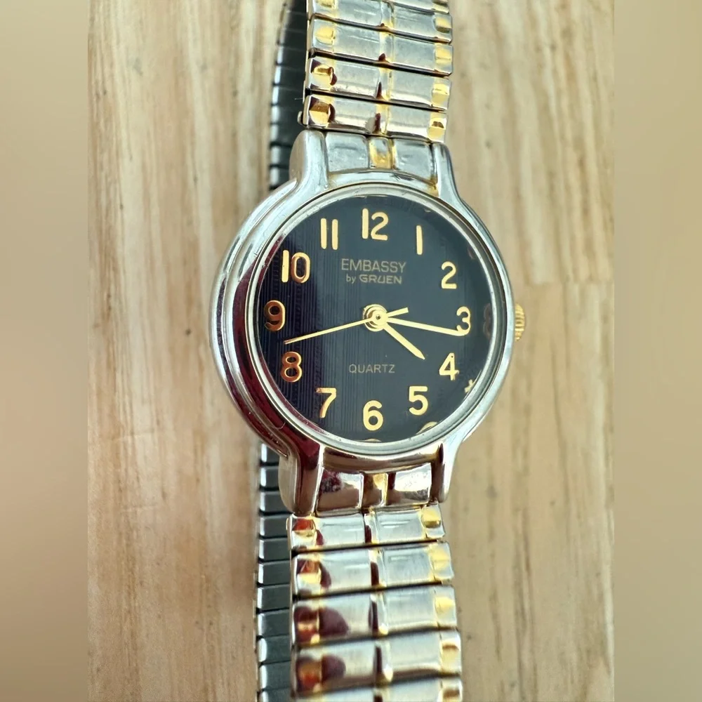 Embassy by Gruen ladies black dial two tone expansion bracelet watch NEW BATTERY